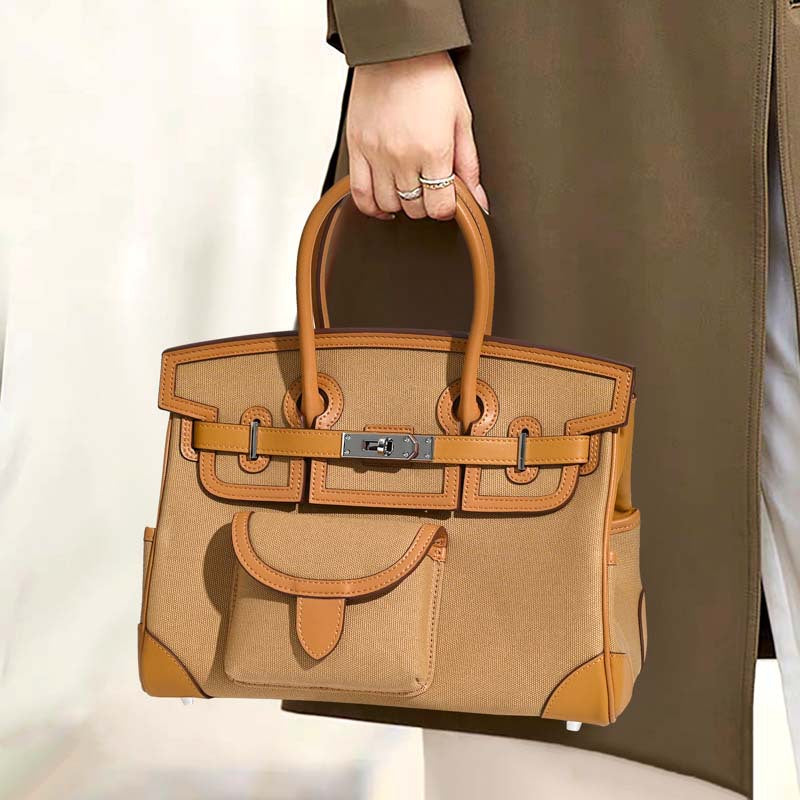 Jane Explorer 30 – Tasche aus Togo-Leder und Premium-Canvas
